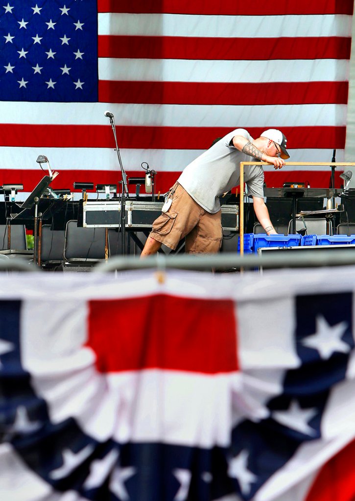 Scott Trouwborst of Moonlighting Production Services sets up the sound on the stage where Don McLean and the Portland Symphony Orchestra will perform during the "Stars and Stripes Spectacular," Portland's Fourth of July fireworks and concert celebration on the Eastern Promenade in Portland on July 3, 2013.