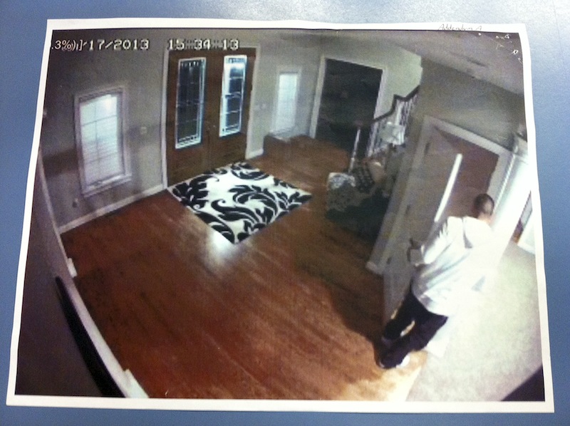This photo taken from former New England Patriots player Aaron Hernandez's home surveillance system in North Attleborough, Mass., and released in documents by Attleboro District Court on July 9, 2013, as one in a series of images authorities said show Hernandez at home with what appears to be a gun, shortly after Odin Lloyd was shot to death on June 17. Hernandez pleaded not guilty to murder in Lloyd's death. (AP Photo/Attleboro District Court)