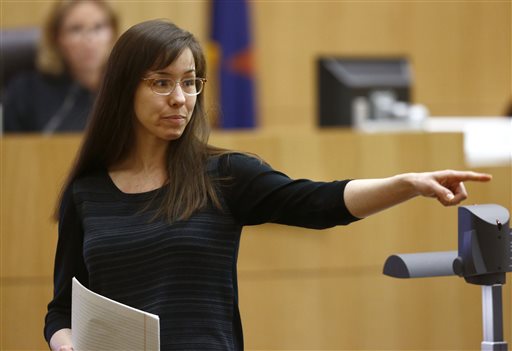 In this May 21, 2013, photo, Jodi Arias points to her family as a reason for the jury to give her life in prison instead of the death penalty, during the penalty phase of her murder trial at Maricopa County Superior Court in Phoenix. As she awaits a decision by prosecutors on the future of her murder case, Arias and her attorneys are returning to court Tuesday to ask the judge to throw out the jury's finding that made her eligible for the death penalty.