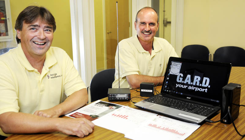 Ron Cote, left, and John Guimond have built a device that records radio traffic for use at airports.