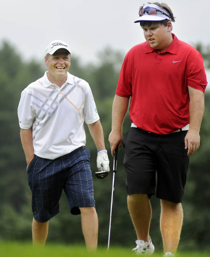 The winner smiles: Ricky Jones, left, shares a laugh with Ryan Gay on Thursday during the final round of the Maine Amateur championship at the Augusta Country Club in Manchester. Jones shot 6-under par for the tournament to win his third title. Gay finished tied for fourth.