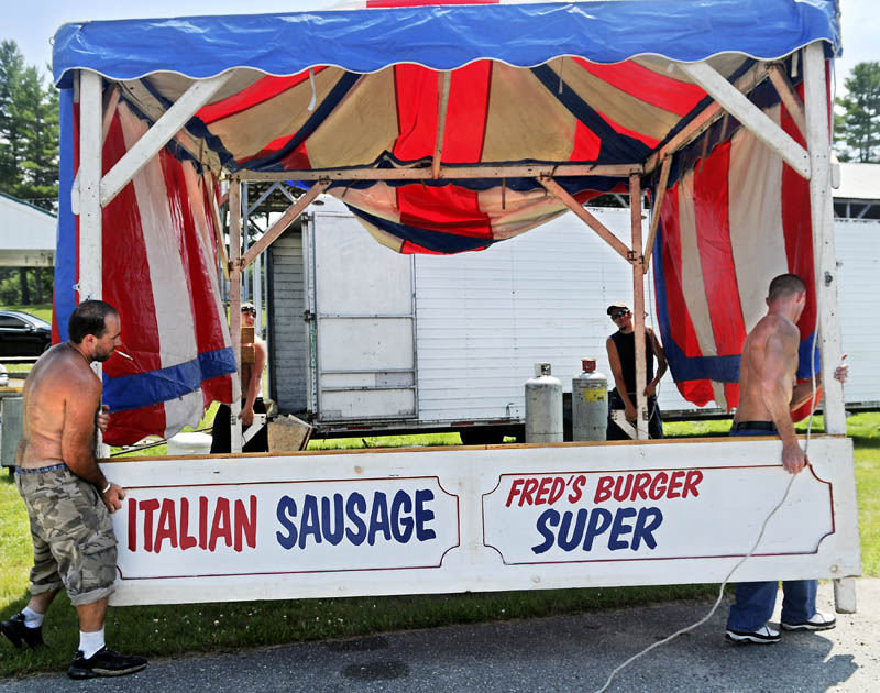 Workers move Fred's Food Stand into place Wednesday on the fairway at the Pittston Fair. The annual agricultural exhibition is scheduled to open Thursday, with rides from Kavanaugh Amusements expected to open later that day.