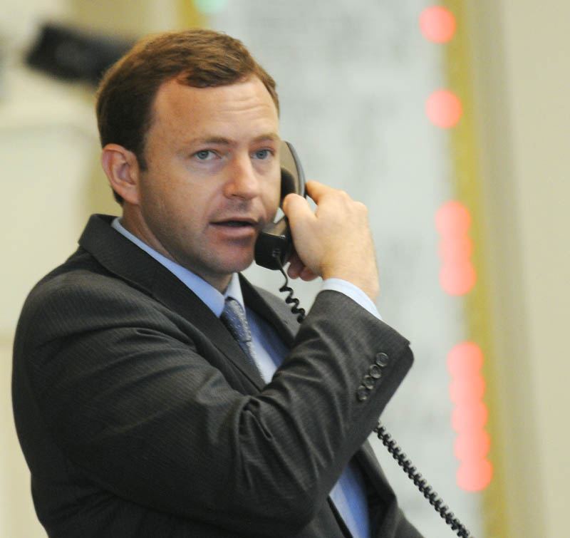 Speaker of the House Mark Eves, D-North Berwick, speaks on the phone during a vote Tuesday in the House of Representatives.