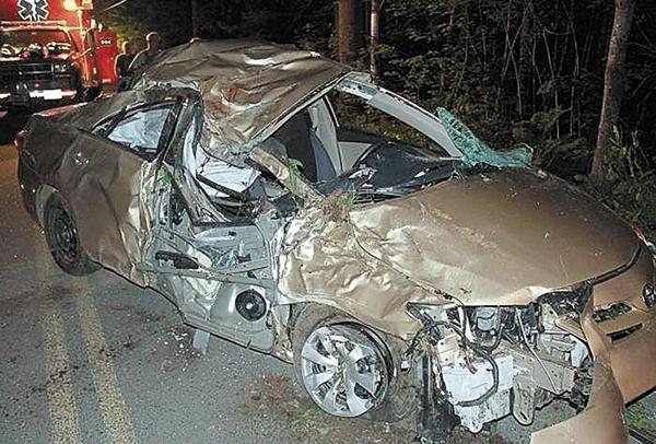 A 2011 Toyota Corolla is seen after crashing into a tree June 16, 2012 in Belgrade. The driver, Travis Lawler, 22, originally from the Oakland area was ordered to serve an initial four years behind bars for a drunken-driving crash that killed his sister and her boyfriend in Belgrade.