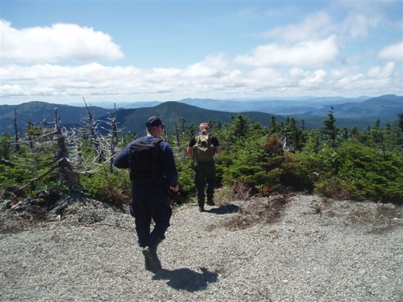 Maine State Police Detective Lenny Bolton, left, and warden service Sgt. Jeff Spencer hike toward Spaulding Mountain from the summit of Sugarloaf today, as the search continued for missing hiker Geraldine Largay, 66, of Tennessee, who was last heard from via text message on Monday.