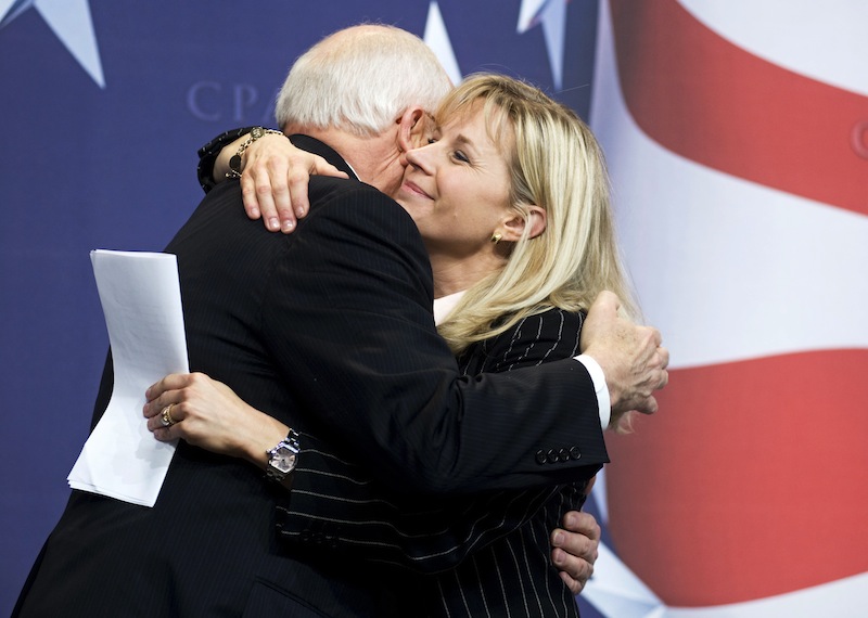 This Feb. 18, 2010 file photo shows Former Vice President Dick Cheney hugs his daughter, Liz Cheney, at the Conservative Political Action Conference (CPAC) in Washington. Liz Cheney says she will run against Wyoming's senior U.S. senator in next year's Republican primary. (AP Photo/Cliff Owen, File)