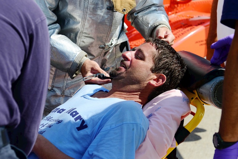 Lobsterman John Aldridge lies on a stretcher at Air Station Cape Cod in Sandwich, Mass., after being rescued by a Coast Guard helicopter. Aldridge, a fisherman for 19 years, fell overboard and spent 12 hours floating in the ocean south of Montauk, N.Y., before he was rescued. He credited his rubber boots for saving his life.