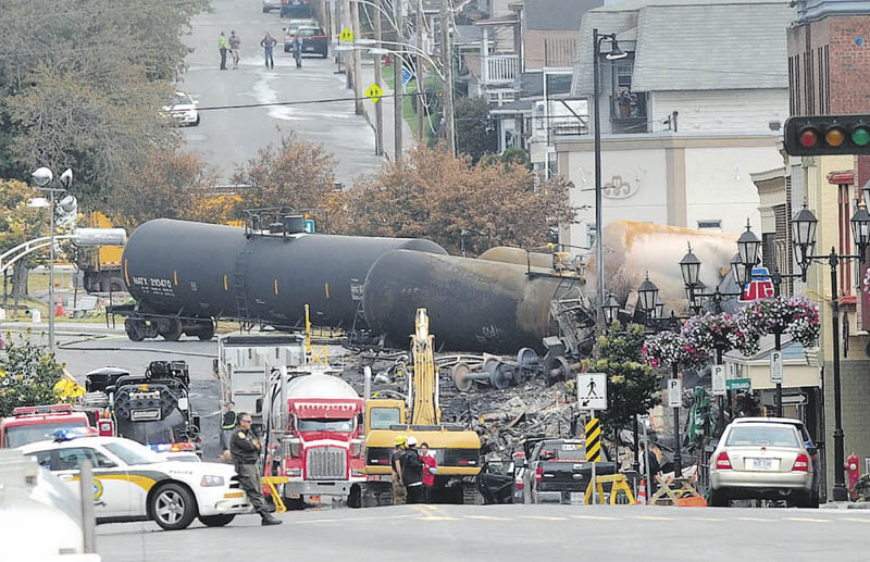 Crude oil tankers from the Montreal, Maine & Atlantic railways are seen in the heart of downtown Lac-Megantic, Quebec, where the runaway train exploded killing at least 20 with 40 others still missing and presumed dead.
