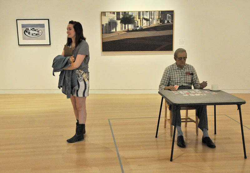 Blair Hudson, 18, a student at the Maine Academy of Natural Sciences, stands next to a Duane Hanson's "Old Man Playing Solitaie, 1973," during a private tour of the Colby College Museum of Art, before the Community Day Celebration scheduled for Sunday.