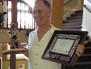 Keith Carradine accepts his Mid-Life Achievement Award Monday at the Maine International Film Festival.
