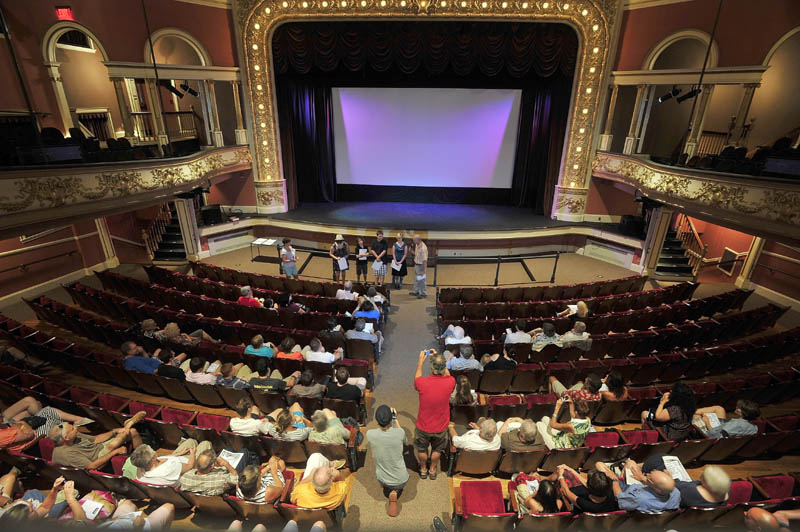 James Coleman hands out awards to student directors during the Maine Student Film Festival at the Waterville Opera House on Saturday.