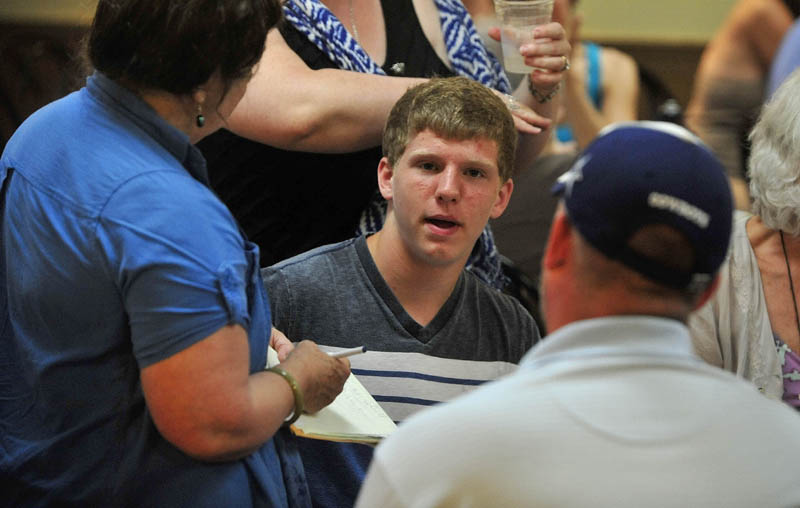 Drew Davis, 14, of Readfield, speaks with a reporter during a reception at Jorgensen's Cafe in Waterville after the Maine Student Film Festival on Saturday. Davis won in the Junior category for his movie "Terror."