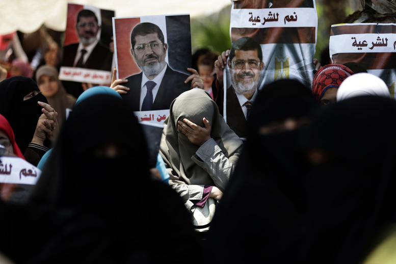 A supporter of ousted Egyptian President Mohammed Morsi cries during a protest near the University of Cairo in Giza, Egypt, on Friday.