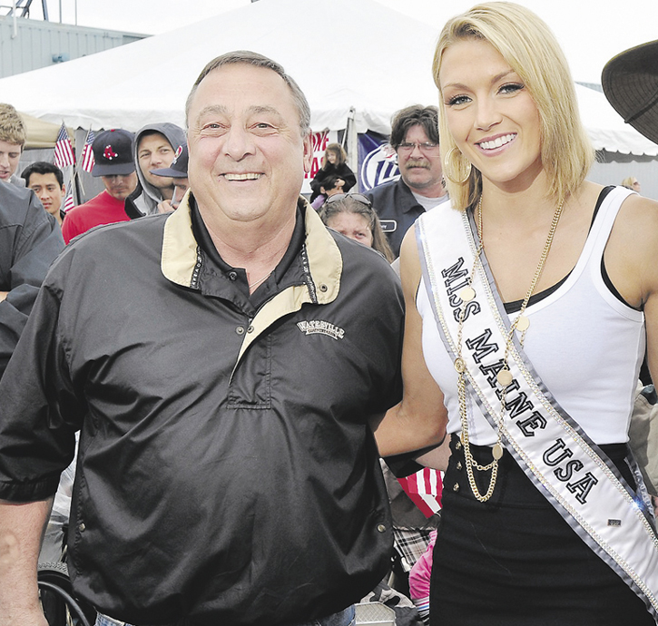 This file photo shows Gov. Paul LePage and then Miss Maine USA Ashley Marble at the 2011 Lobster Festival on Maine State Pier.