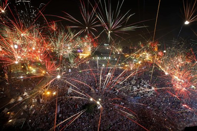Fireworks light the sky opponents of Egypt's Islamist President Mohammed Morsi celebrate in Tahrir Square in Cairo, Egypt, Wednesday, July 3, 2013. A statement on the Egyptian president's office's Twitter account has quoted Mohammed Morsi as calling military measures "a full coup." The denouncement was posted shortly after the Egyptian military announced it was ousting Morsi, who was Egypt's first freely elected leader but drew ire with his Islamist leanings. The military says it has replaced him with the chief justice of the Supreme constitutional Court, called for early presidential election and suspended the Islamist-backed constitution. (AP Photo/Amr Nabil)