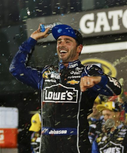 Jimmie Johnson celebrates in Victory Lane after winning the NASCAR Sprint Cup race Saturday at Daytona International Speedway.
