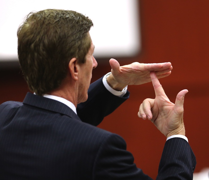 Defense counsel Mark O'Mara gestures while describing the possible angle of the gun shot that killed Trayvon Martin, during a hearing before the start of the George Zimmerman trial in Seminole CIrcuit Court, in Sanford, Fla., Tuesday, July 9, 2013. Zimmerman is charged with SECOND-degree murder in the fatal shooting of Trayvon Martin, an unarmed teen, in 2012. (AP Photo/Orlando Sentinel, Joe Burbank, Pool)