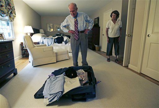 Retired U.S. Navy Capt. Thomas Hudner talks with his wife Georgea while packing for his trip to North Korea.