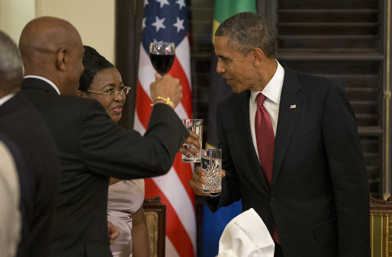 President Barack Obama toasts with Tanzanian first lady Salma Kikwete during an official dinner at the State House in Dar Es Salaam, Tanzania, on Monday. The president is traveling in Tanzania on the final leg of his three-country tour in Africa.