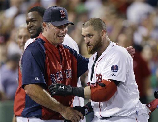 Boston Red Sox outfielder Jonny Gomes, right, is congratulated by manager John Farrell after his pinch-hit walk-off solo home run in the ninth inning of an interleague game against the San Diego Padres on Wednesday at Fenway Park in Boston. Boston won 2-1.