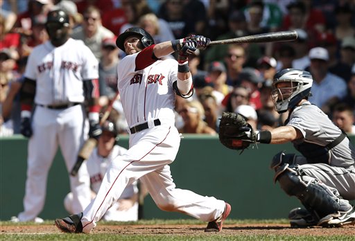 Boston Red Sox's Dustin Pedroia follows through on a hit Thursday against the San Diego Padres at Fenway Park in Boston. The Red Sox won 8-2.