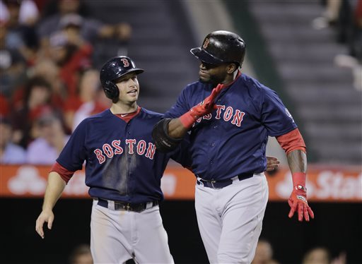 Boston Red Sox's David Ortiz, right, celebrates his two-run home run with Daniel Nava during the eighth inning of a baseball game against the Los Angeles Angels in Anaheim, Calif., Friday, July 5, 2013. (AP Photo/Jae C. Hong)