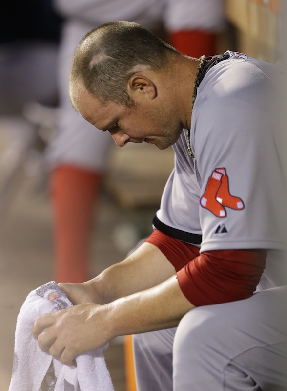 Boston Red Sox starting pitcher Jon Lester sits in the dugout after being pulled in the sixth inning of a baseball game against the Seattle Mariners, Monday, July 8, 2013, in Seattle. (AP Photo/Ted S. Warren)