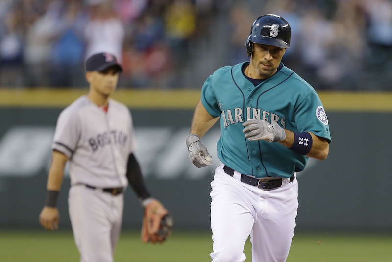 Seattle Mariners' Raul Ibanez, right, 'rounds the bases after hitting a solo home run against the Boston Red Sox in the fifth inning of a baseball game, Monday, July 8, 2013, in Seattle. (AP Photo/Ted S. Warren)