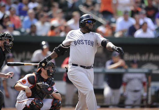 Boston Red Sox designated hitter David Ortiz follows through on his single during the eighth inning Sunday against the Baltimore Orioles at Camden Yards in Baltimore. The Red Sox won 5-0.