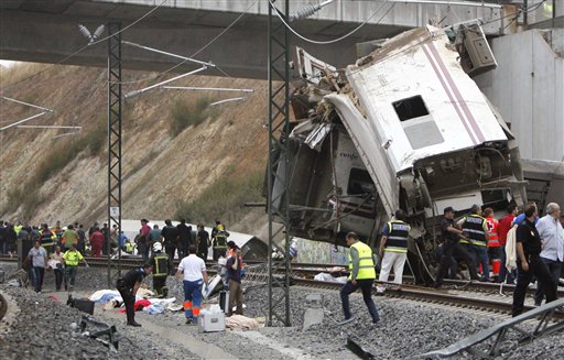 Emergency personnel respond to the scene of a train derailment in Santiago de Compostela, Spain, on Wednesday. Although it was not one of Spain's fastest trains, it was a relatively luxurious version that uses the same kind of track as Spain's fastest expresses.