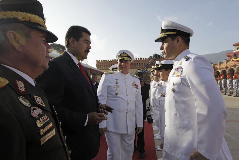 Venezuela's Defense Minister Admiral Diego Molero, far left, Venezuela’s President Nicolas Maduro, second from left, and Chief of Strategic Command Gen. Wilmer Barrientos, center, attend a military promotion ceremony at the 4F military museum in Caracas, Venezuela, Friday, July 5, 2013. On Friday Venezuela marks its 202 independence anniversary from Spain. (AP Photo/Ariana Cubillos)