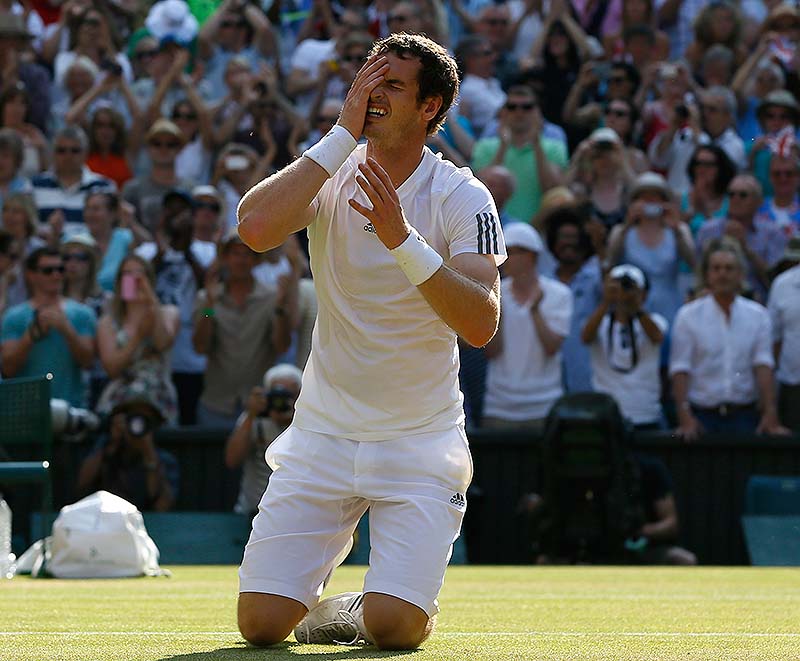 Andy Murray reacts after beating Novak Djokovic for the men's Wimbledon championship Sunday in London. Murray became the first British man to win the title in 77 years.