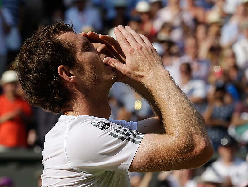 Murray reacts after defeating Novak Djokovic in straight sets for the men's title at Wimbledon on Sunday.