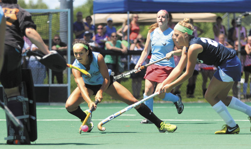 AN ALL-STAR CAST: Recent Messalonskee High School graduate Kristy Bernatchez, playing for the East squad, tries to put a shot on the West's goalie Patty Smith of Gorham High School while being defended by Falmouth High School's Sarah Sparks, right, during the annual McNally Senior All-Star Field Hockey game on Saturday at Colby College in Waterville. Bernatchez plans to attend the University of North Carolina at Chapel Hill this fall.