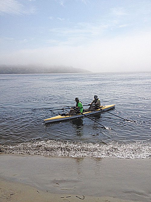 NOT SO SMOOTH SAILING: David Grody, left, and Dan Benson take off from Popham Beach on a practice run June 30. Fog set in quickly and the pair found themselves lost and swimming for their lives.
