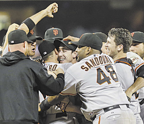 YOU DID IT: The San Francisco Giants celebrate after a no-hitter thrown by Tim Lincecum, center, against the San Diego Padres on Saturday in San Diego. The Giants won the game 9-0.