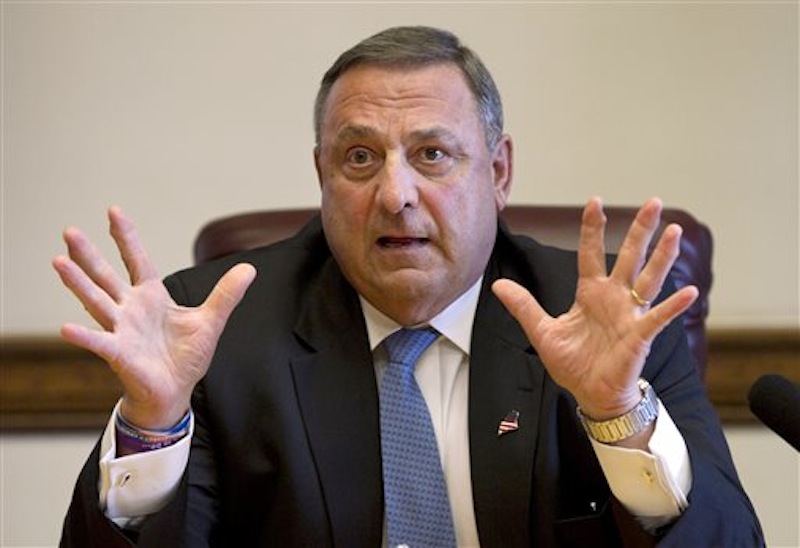 In this June 26, 2013 file photo, Gov. Paul LePage speaks to reporters shortly after the Maine House and Senate both voted to override his veto of the state budget at the State House in Augusta, Maine. LePage vetoed an increase in the state's minimum wage Monday, July 8, 2013. (AP Photo/Robert F. Bukaty, File)