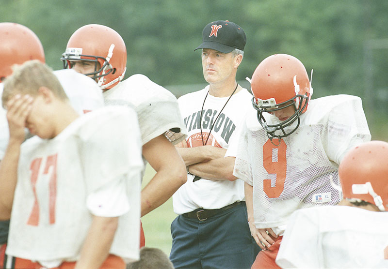 A FIXTURE AT WINSLOW: Jim Poulin, shown here coaching during the 1999 football season, has spent 38 seasons as an assistant coach for the Winslow High School football team. Poulin decided to retire this offseason.