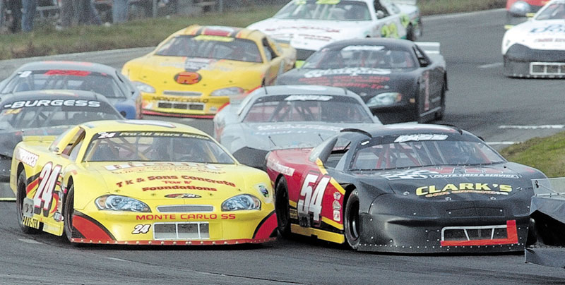 DECISIONS, DECISIONS: Johnny Clark (54) has two race cars to choose from when he runs on Sunday during the TD Bank 250 at Oxford Plains Speedway.