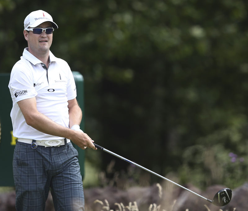 IN THE LEAD: Zach Johnson shot 5-under par 66 in the first round of the British Open to take a one-shot lead over Rafael Cabrera-Bello and Mark O’Meara on Thursday at Muirfield, Scotland.