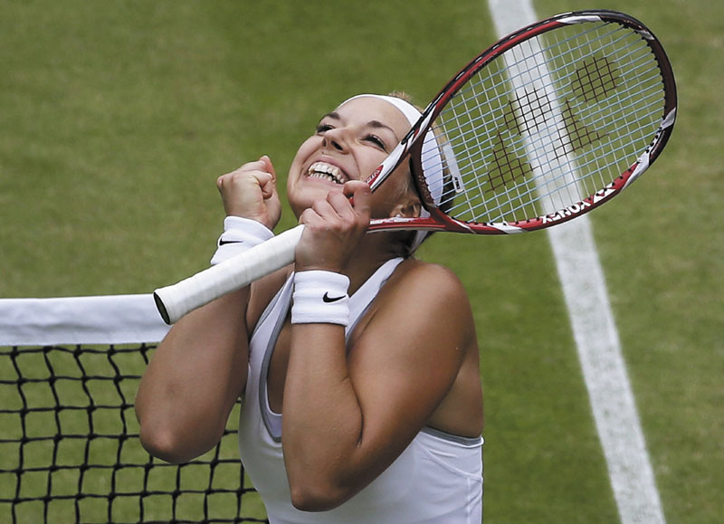 ALL SMILES: Sabine Lisicki celebrates after beating Kaia Kanepi in the quarterfinals of Wimbledon on Tuesday in Wimbledon, London. Lisicki advanced to the semifinals with a 6-3, 6-3 win.