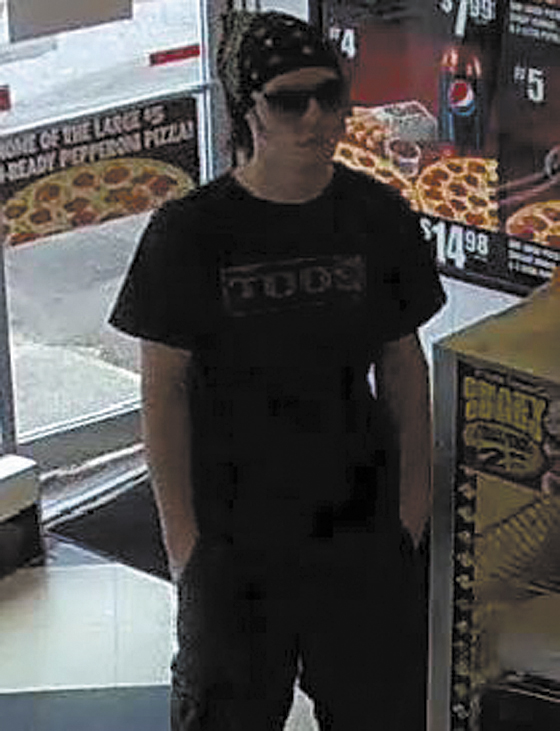 This surveillance photo from the Little Caesars restaurant on Main Street in Waterville shows the suspect in its robbery earlier today.