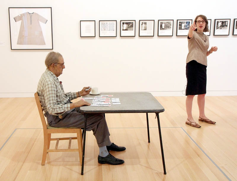 Duane Hanson's sculpture "Old Man Playing Solitaire," foreground, is on display at the Lunder Collection, as Colby College Museum of Art Director and Chief Curator Sharon Corwin gives a tour for members of the media on Tuesday in Waterville.
