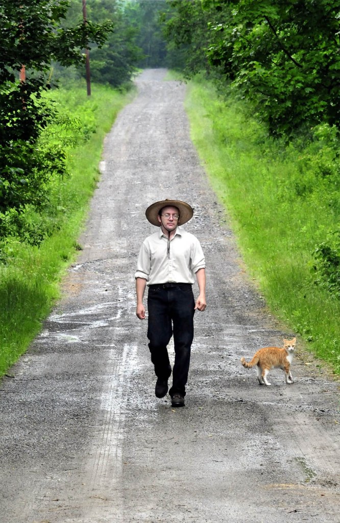 Jacob Underwood walks toward his home in Cornville on the former Nichols Road on Tuesday. Residents this week voted to discontinue the road and eliminate the public easement, effectively giving Underwood ownership of the roadway.