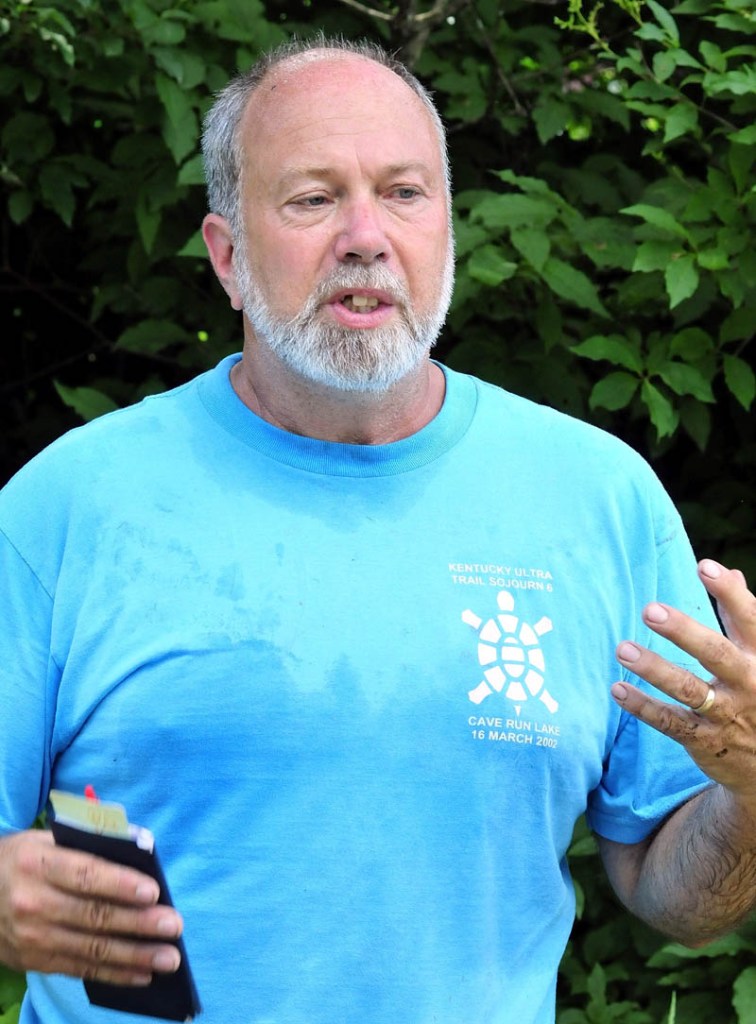 Maurice Martin speaks about the potential ill effects associated with cell phone technology that may come with the installation of a 195-foot cell tower near his home on the Abijay Hill Road in Starks on Monday.