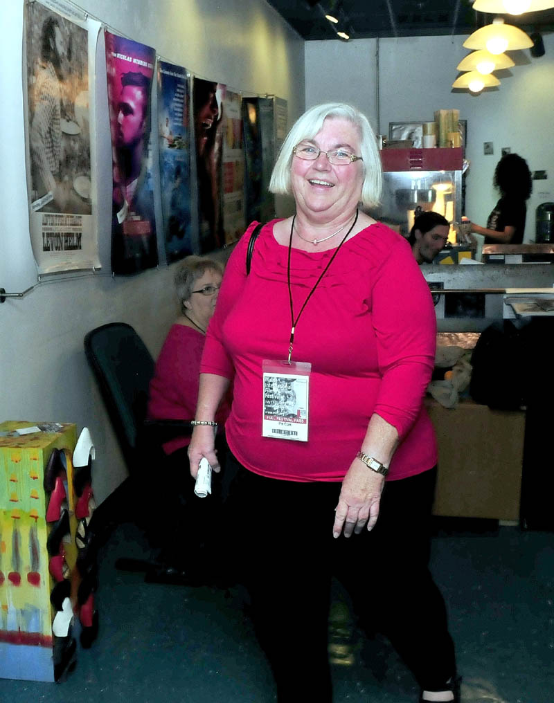Pat Clar,k of Unity, enters the Railroad Square Cinema in Waterville to see a Maine International Film Festival movie on Sunday. Clark said MIFF has shown better movies over the years, and she estimates she has seen 512 films since the festival began 16 years ago.