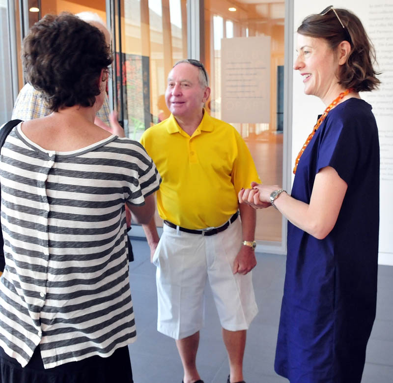 Peter Lunder, center, and Colby College Museum of Art director and curator Sharon Corwin, right, speak with guests during a tour of the expanded Alfond-Lunder Family Pavillion on Community Day on Sunday.