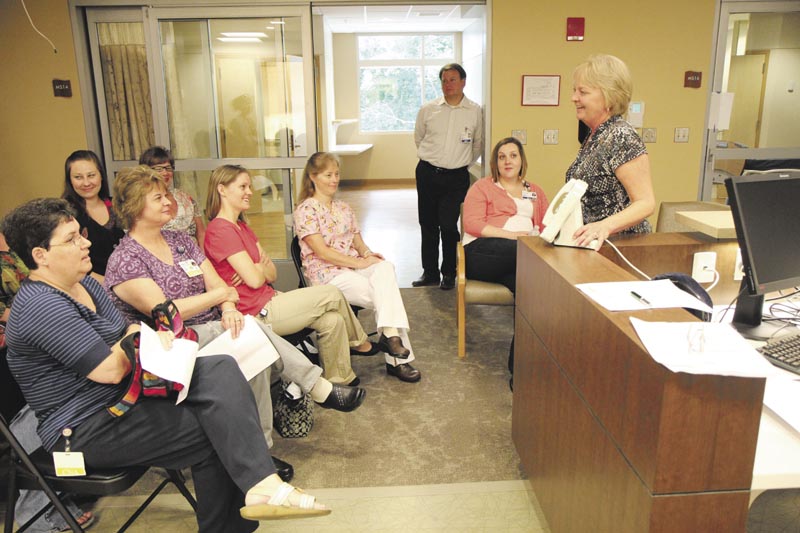 Pam Cobill of Signet Electronics Systems, right, conducts an orientation session on the new calling system inside Sebasticook Valley Hospital's new inpatient wing in Pittsfield on Wednesday.