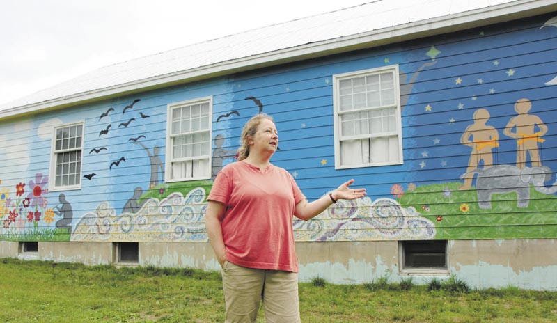 Diane Leeman, a director at the Sparrow's Nest Community Theater in Industry, talks about a mural painted on the outside of the former church turned theater. Leeman said the mural was painted in 2011 by teenagers from Red Clay Creek Presbyterian Church of Wilmington, Del.