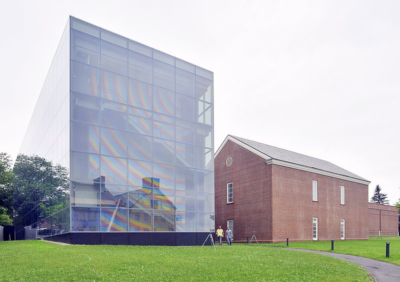 Colby College's $15 million Alfond-Lunder Family Pavilion, left, adds a sparkling new minimalist wing to the museum and brings contrast to a campus rich in classic red-brick structures. Inside, a three-story wall painting by artist Sol LeWitt provides a vibrant splash of color amid the glass- and metal-encased building.